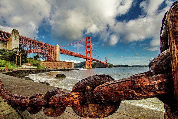 Golden Gate Bridge and Ft Point

This is an image of the Golden Gate Bridge and Ft. Point taken from the edge of the San Francisco Ba. 
I framed the foreground with the old rusty chain that marked the boundary of the parking lot.
As you follow the chain down the left side of the image it brings you around to Ft. Point. This is a large old military fort that was built to protect the opening of the bay. 
The bridge comes in from the upper left over Ft Point and then moves toward the center as it makes it's way across the opening of San Francisco Bay.