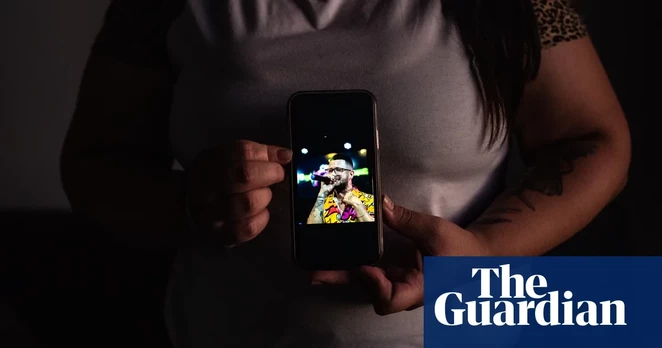 A photo of Arturo Suárez, one of many migrants to the US detained without account by immigration officials, held by his partner. Photograph: Cristóbal Olivares/The Guardian