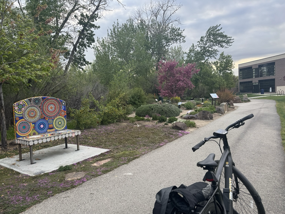 The Garden City pollinator garden behind City Hall, my bike in the foreground.