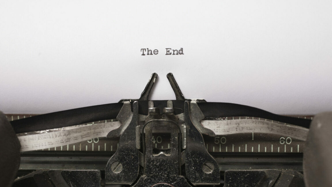 Photo of a typewriter that has typed out "The End" on a piece of paper.