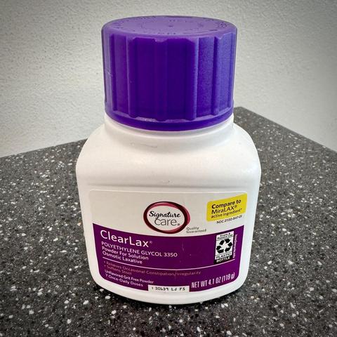 A white and purple bottle of generic MiraLAX. 